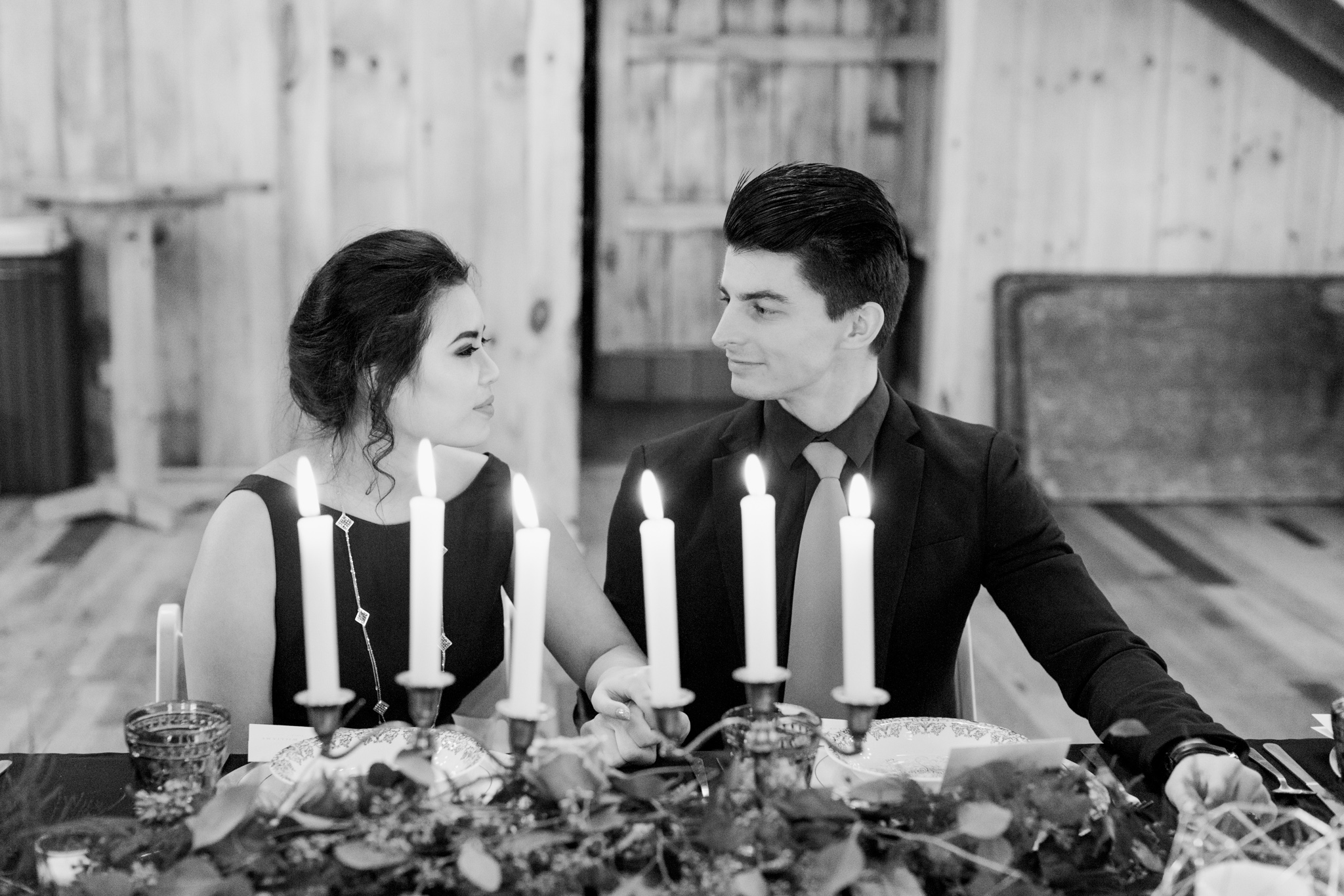 Elegant elopement couple dines over candlelight