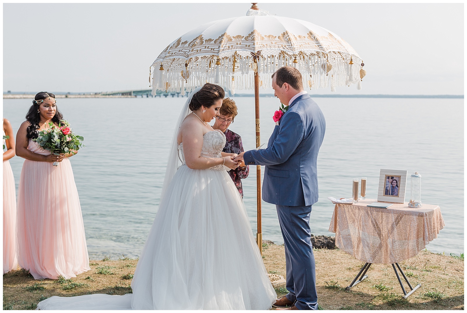 bride and groom exchanging rings during mackinac wedding ceremony