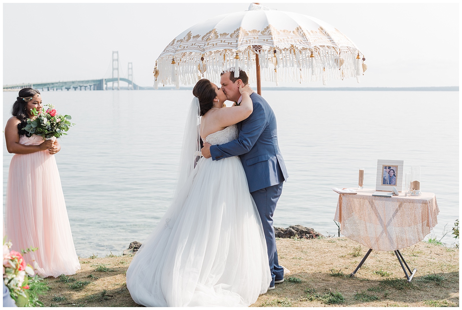 Bride and Groom share first kiss during Mackinac wedding ceremony in St. Ignace, Michigan.