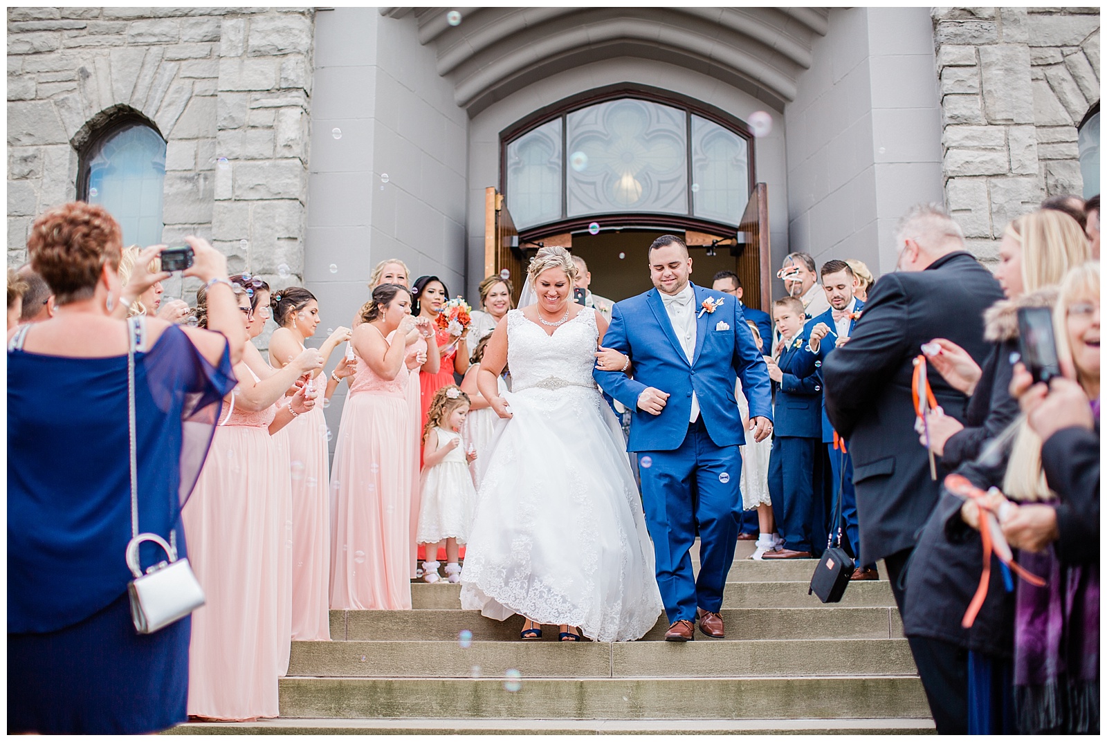 Bride and Groom smiling during bubble exit from wedding at St. Paul Lutheran Church in Dearborn. 
