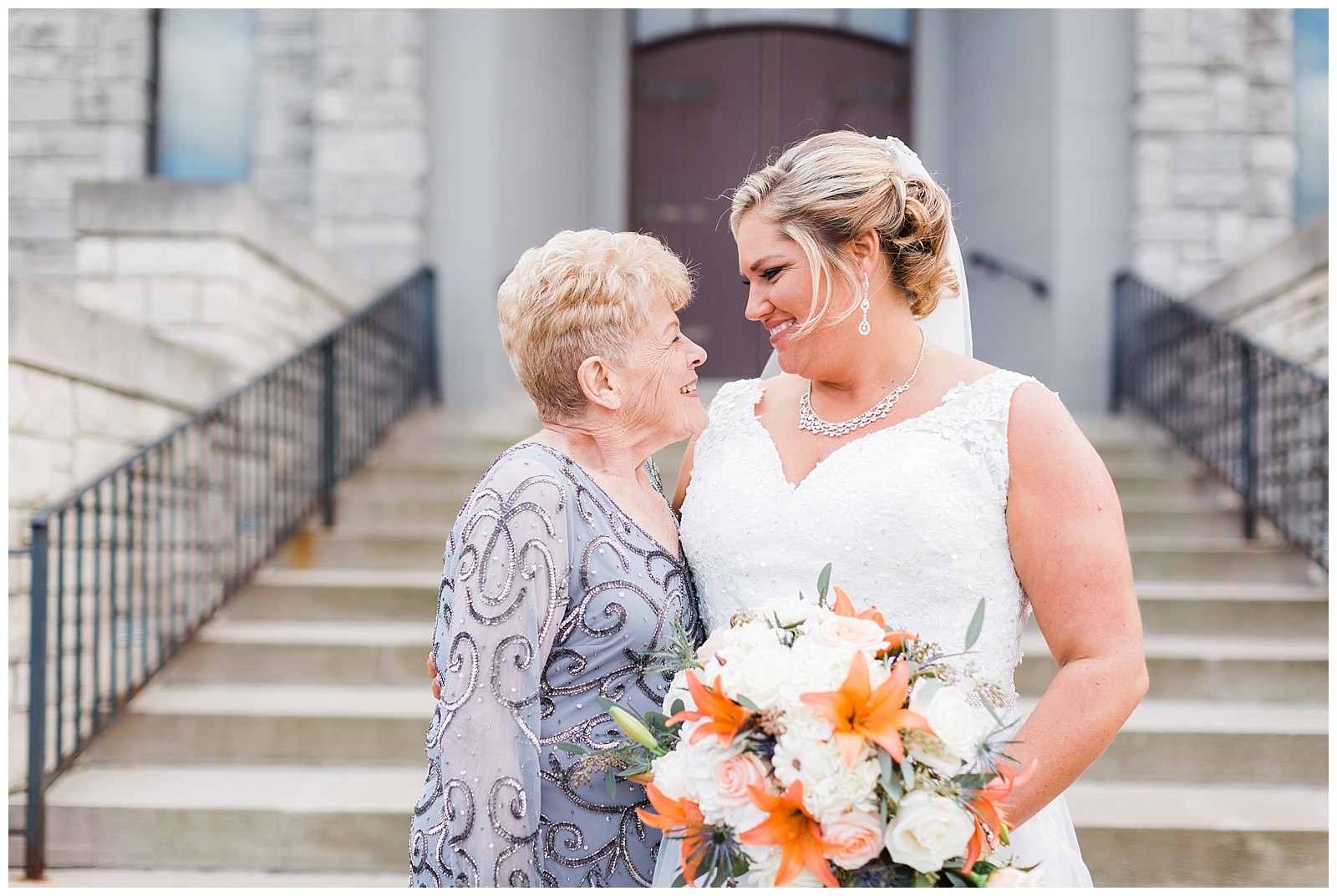 Bride smiles at her grandmother after Fairlane Club Fall Wedding ceremony.