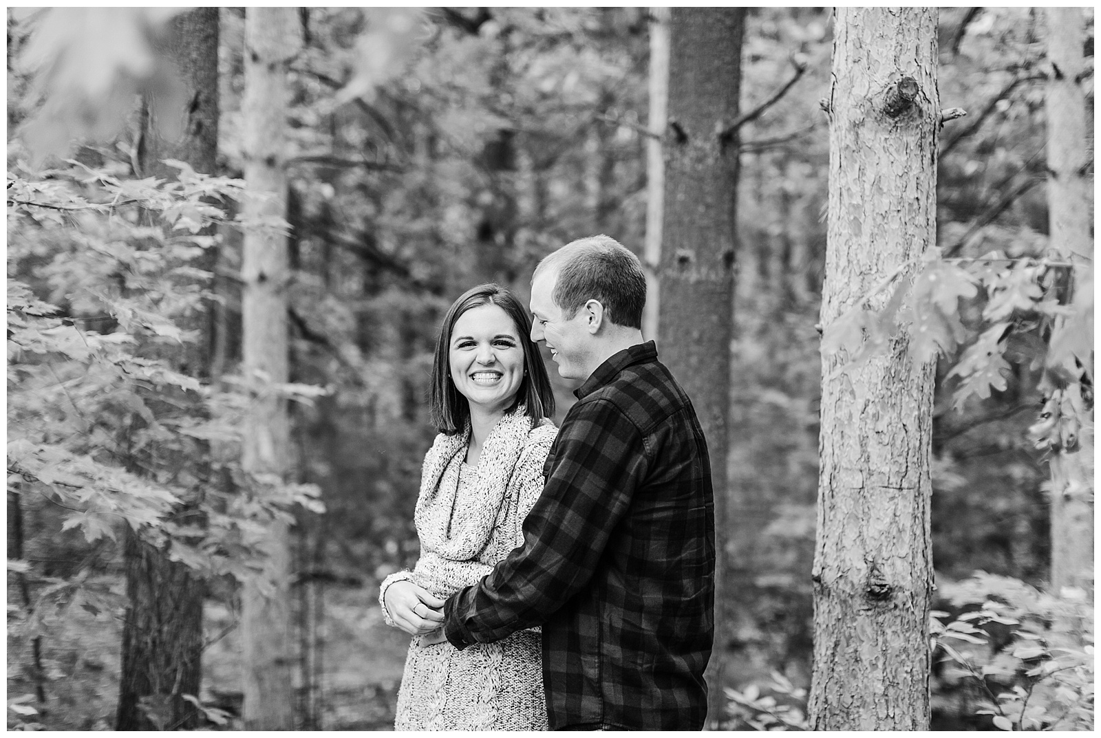 Black and white picture of couple during engagement session for Traverse City wedding photography.