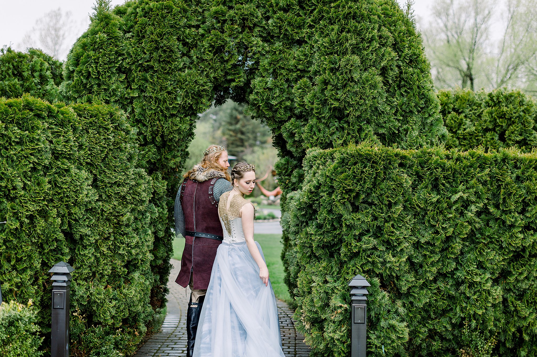 Bride and groom explore gardens at Castle Farms wedding.