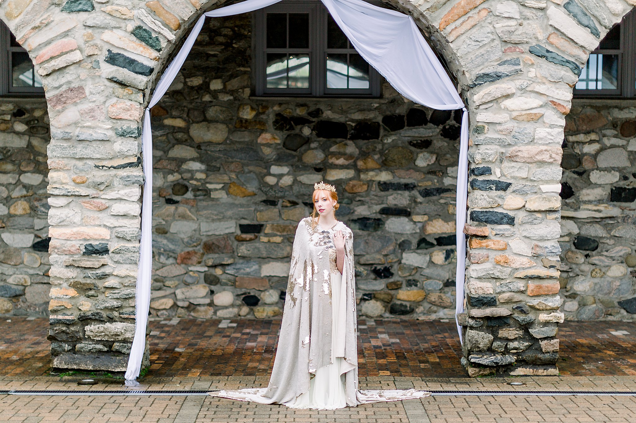 Bride poses in Queens Courtyard during Game of Thrones wedding at Castle Farms in Charlevoix, Michigan.