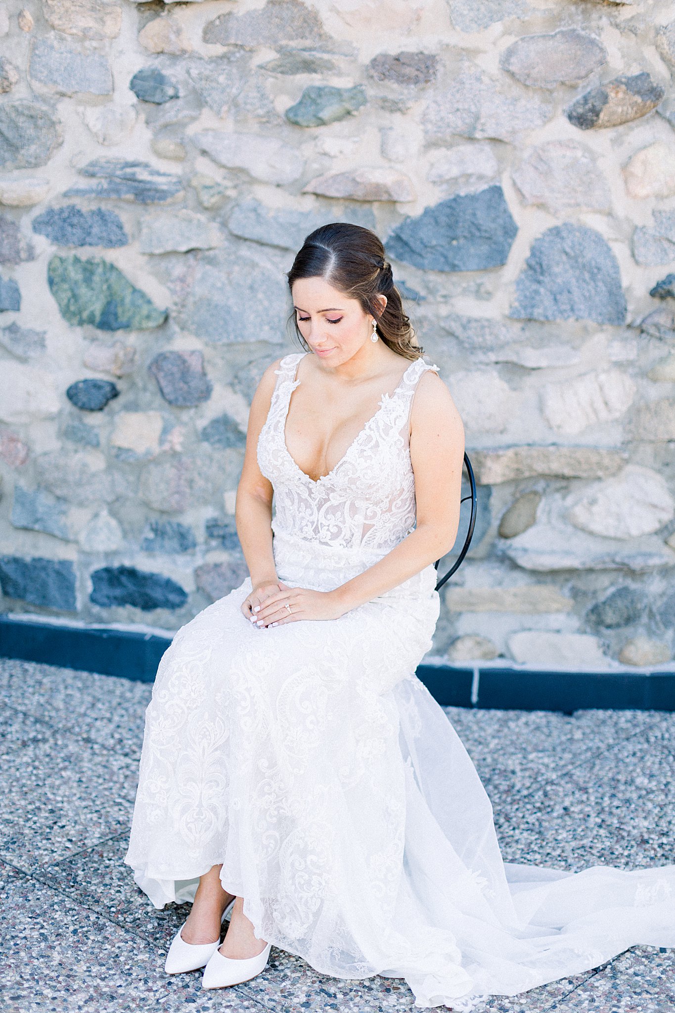Bride rests for a moment before ceremony during Spring Castle Farms wedding.