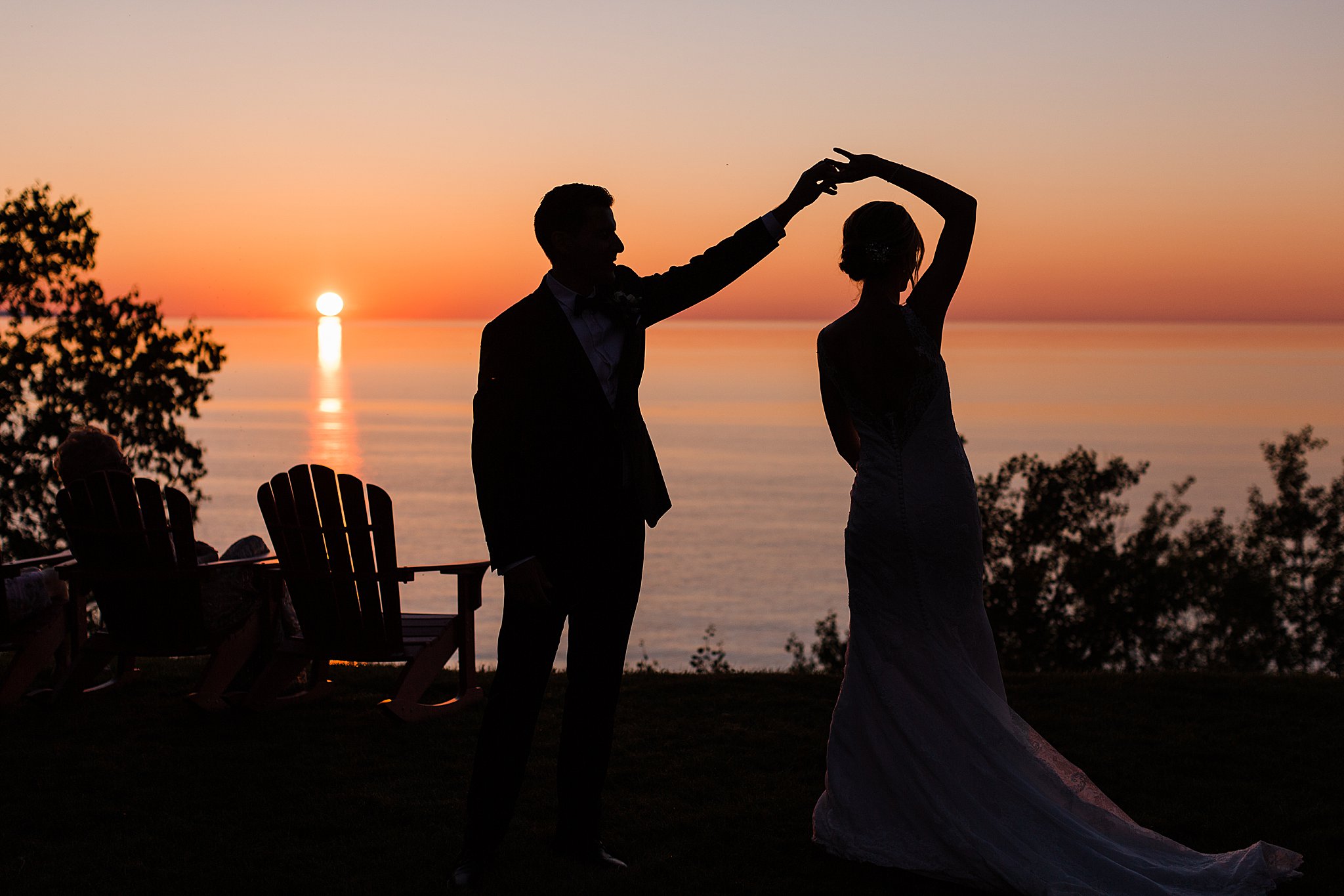 Bride and Groom dance during sunset on Lake Michigan during their intimate Lake Michigan wedding.