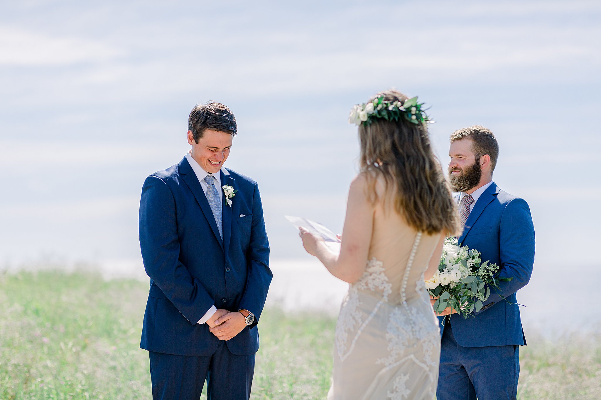 Groom gets emotional during bride's wedding vows at their Northern Michigan elopement.