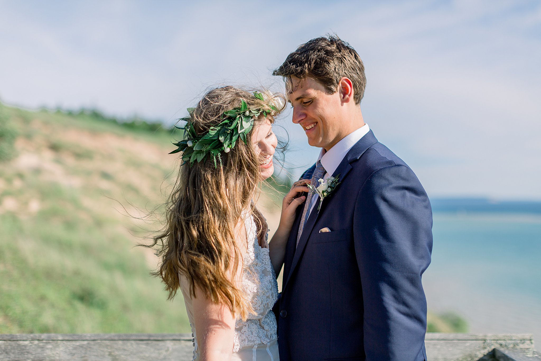 Groom smiles down at new bride during Northern Michigan elopement.