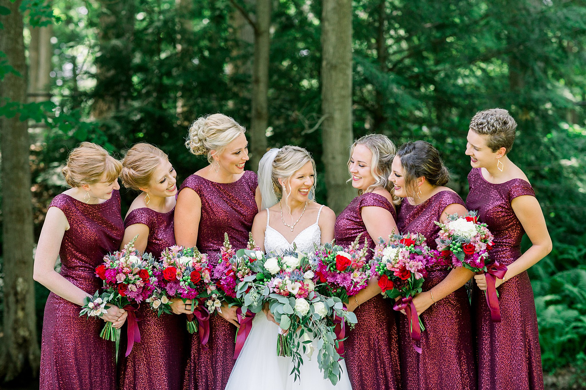 Bridesmaids smiling at each other during Post Family Farm Wedding