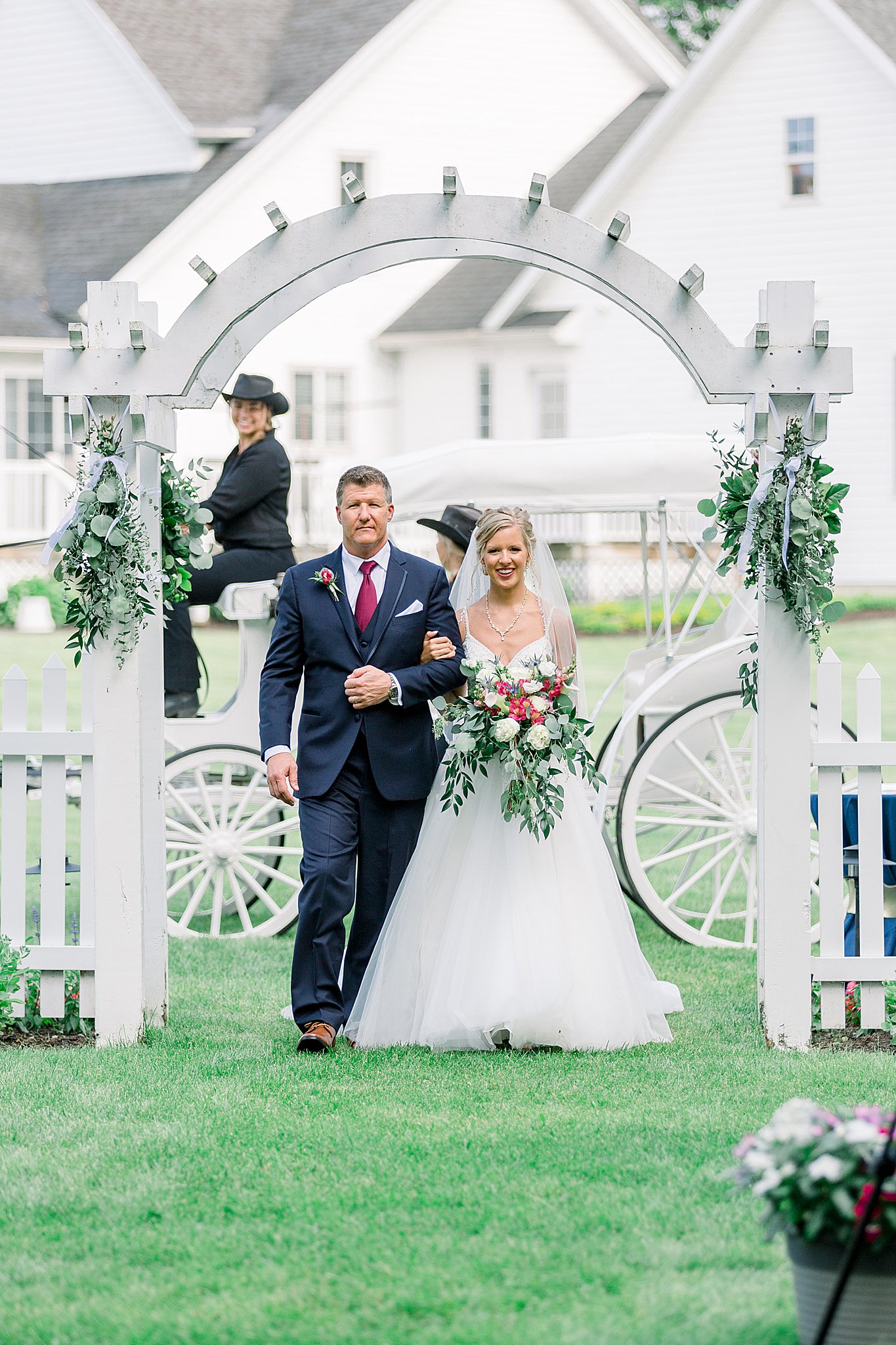 Bride enters ceremony with father of the bride during Post Family Farm Wedding