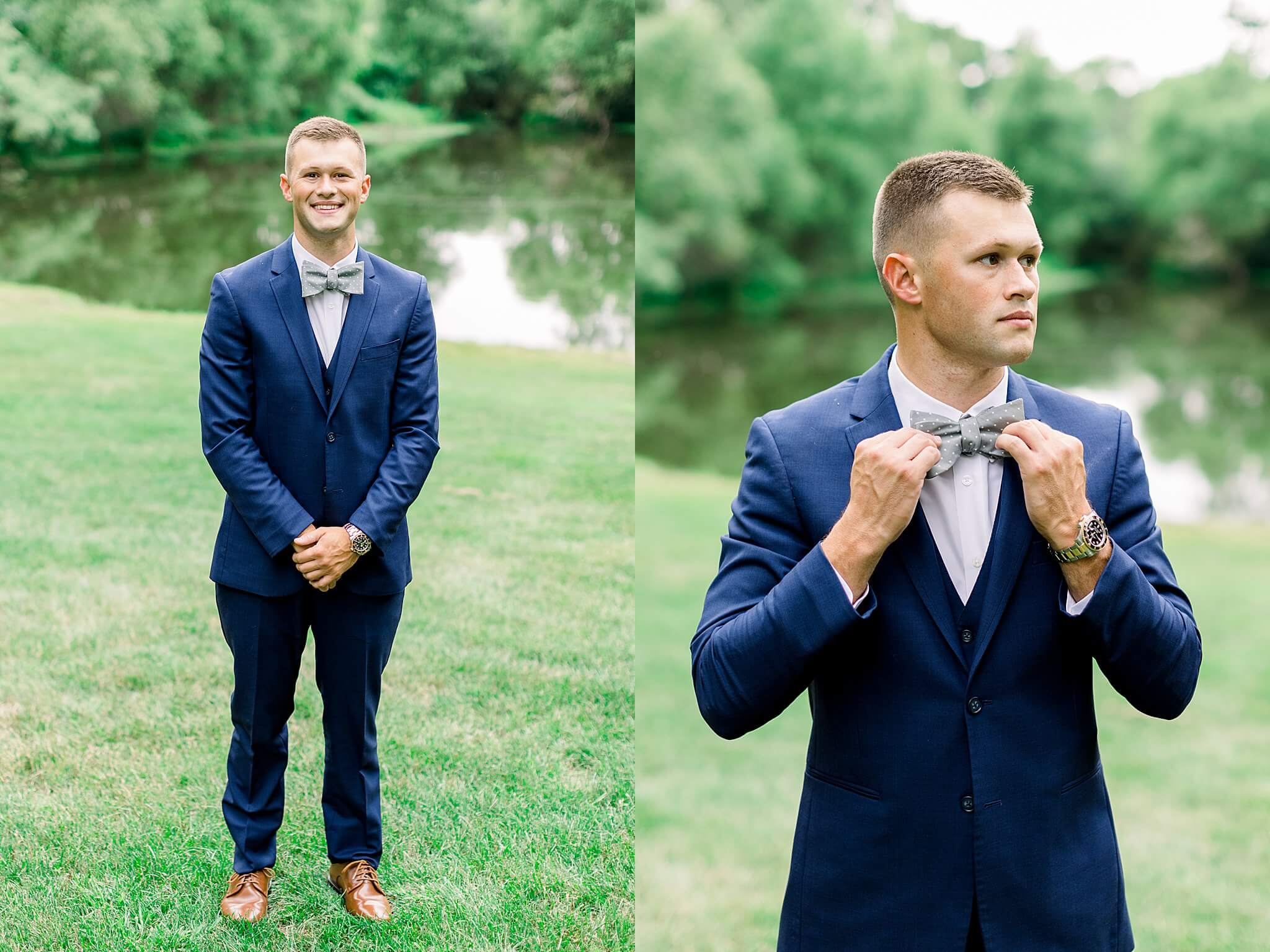 Groom straightens tie in front of pond during summer backyard wedding in Northern Michigan.