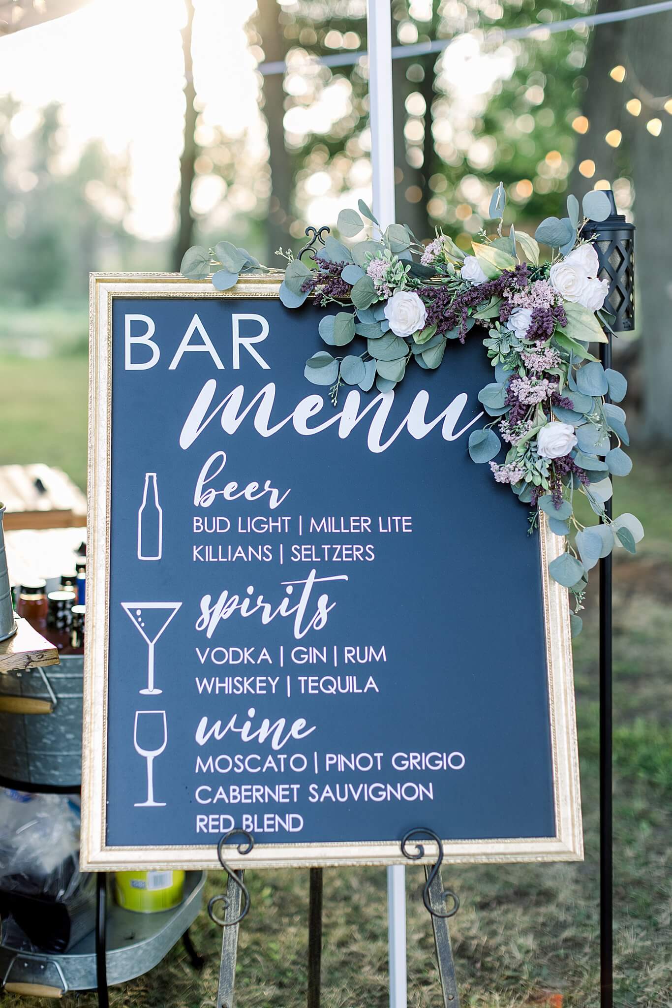Bar menu reception sign at Michigan Summer Backyard Wedding