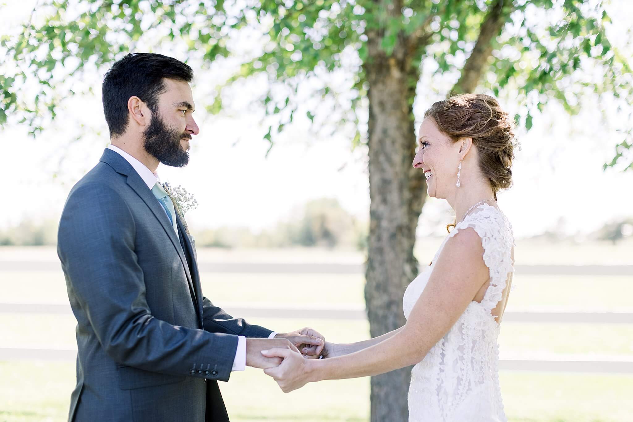 Bride and groom share first look at Crooked Creek Ranch wedding.