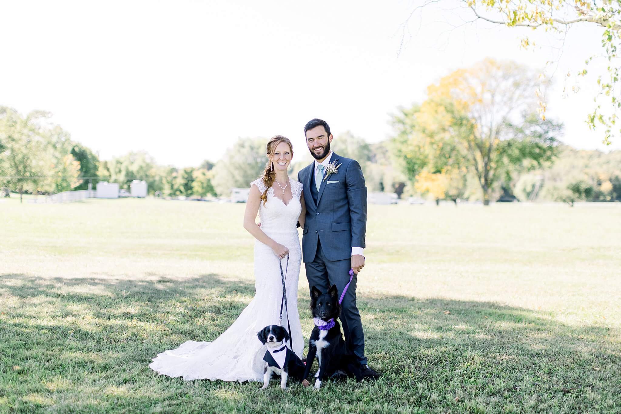 Bride and groom portrait with their dogs during Crooked Creek Ranch wedding.