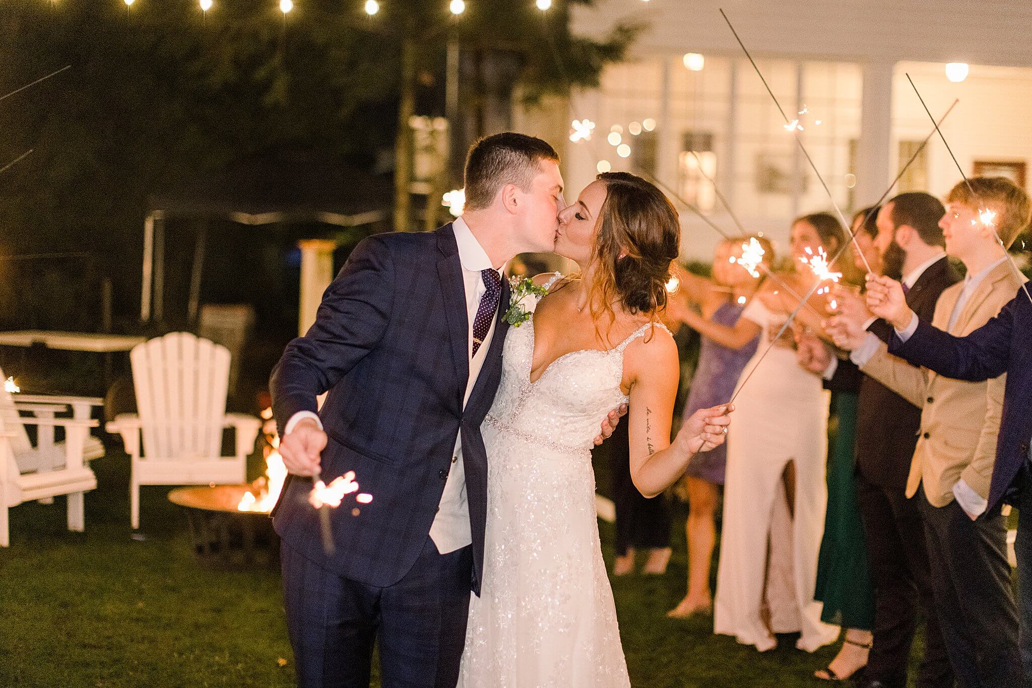 Bride & Groom kiss during sparkler exit at Intimate Northern Michigan Wedding.
