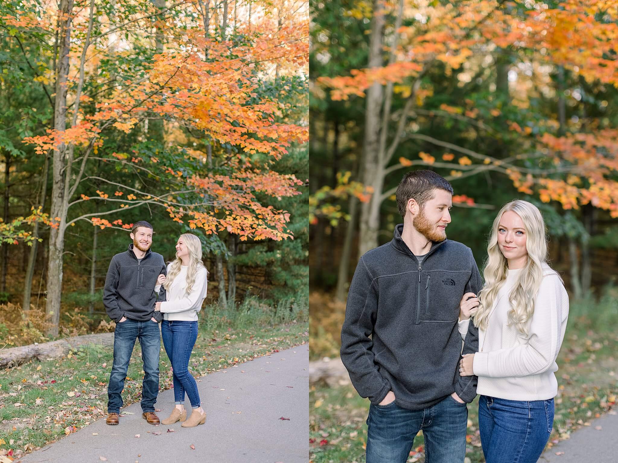 Bride laughs at groom during M22 Fall Engagement Session in Northern Michigan.