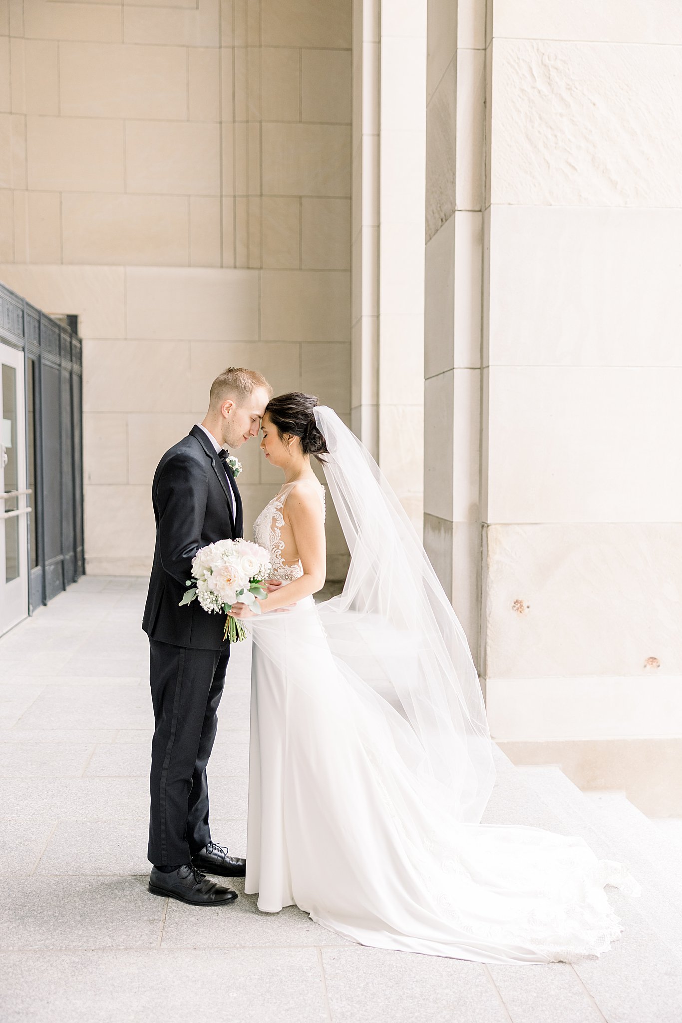 Bride and groom portraits downtown Grand Rapids during elegant Grand Rapids wedding.