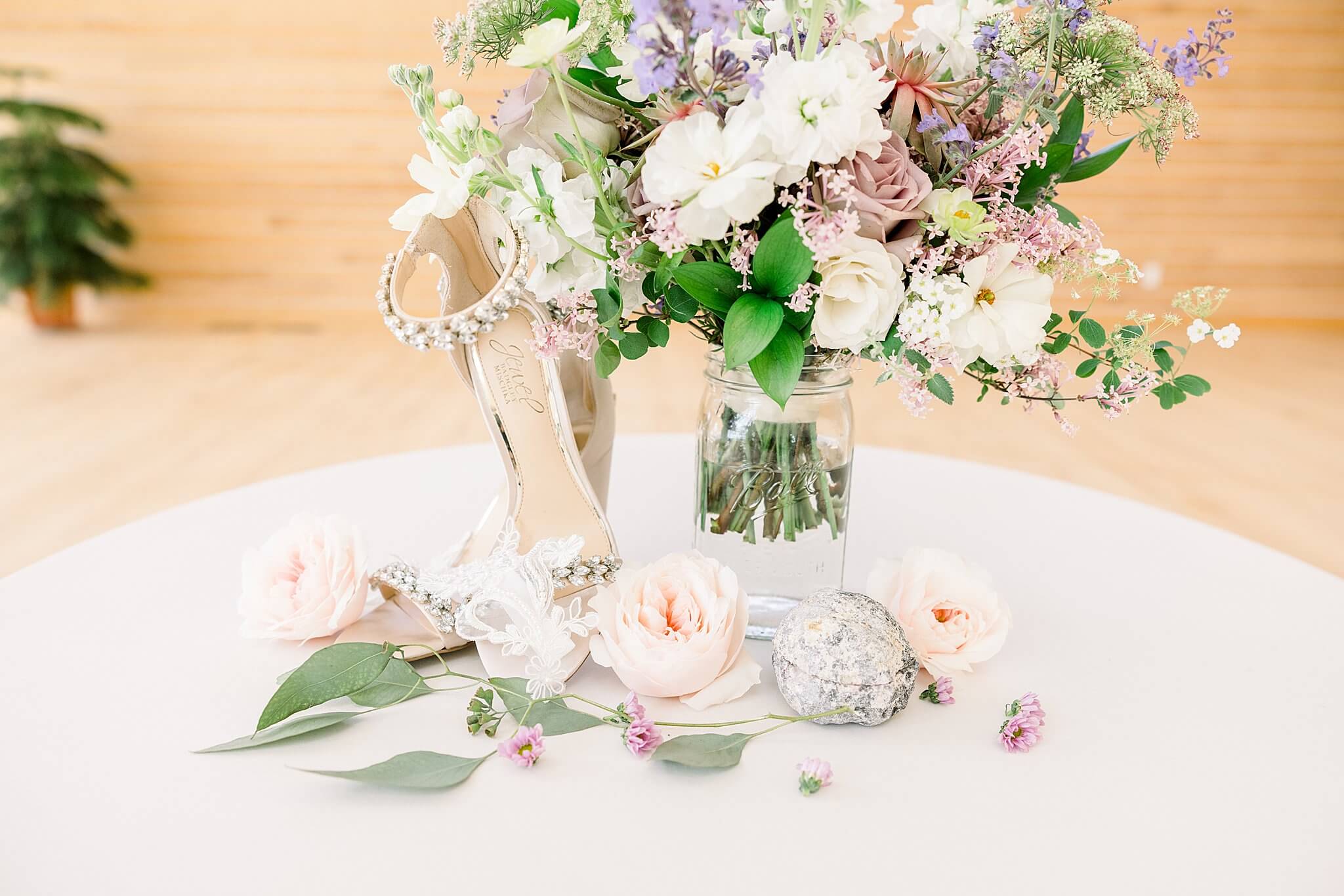 Bride's bouquet and shoes flat lay during Nature Michigan Wedding.