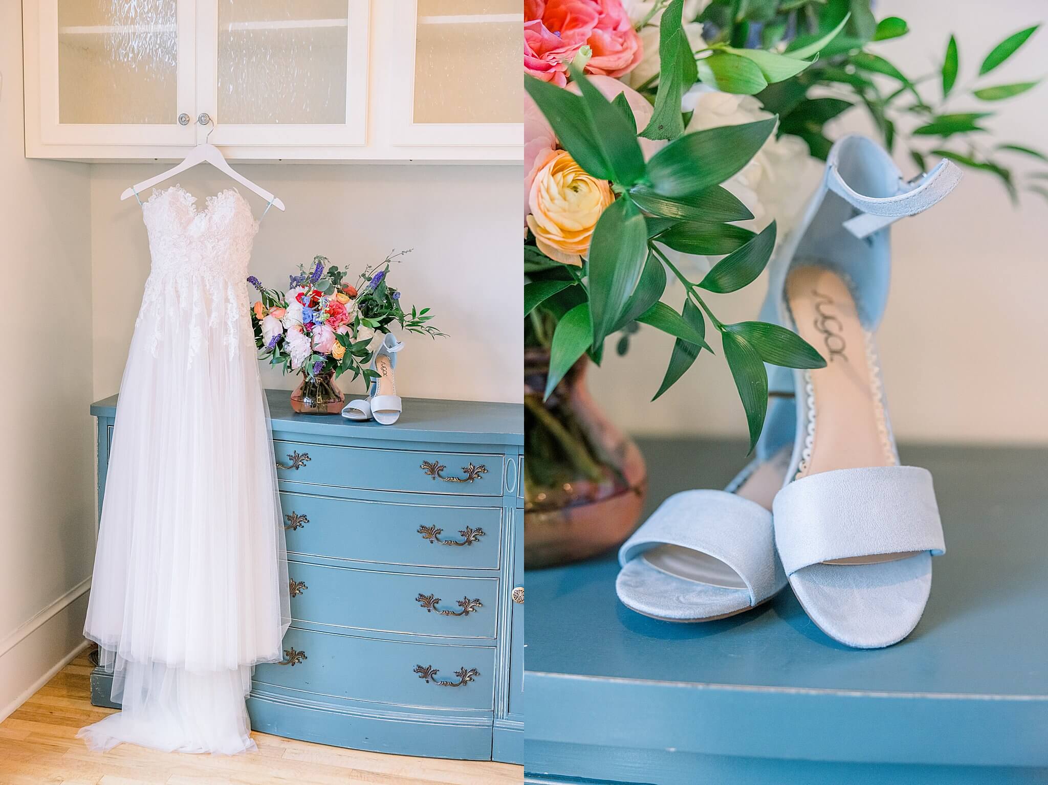 Brides dress hangs in front of vintage blue dresser during rainy Traverse City wedding.