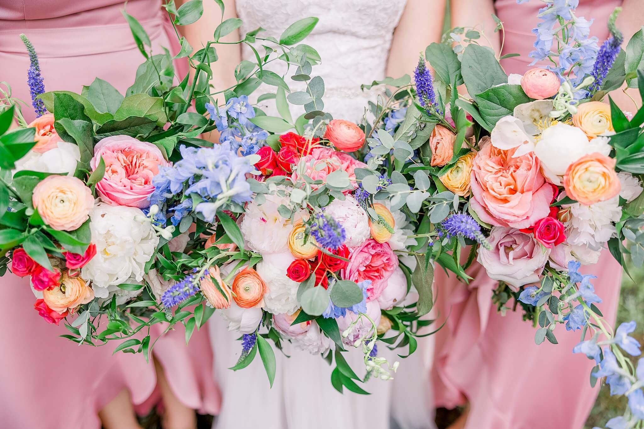 Bright, romantic, colorful floral bouquets for a rainy Traverse City wedding day.