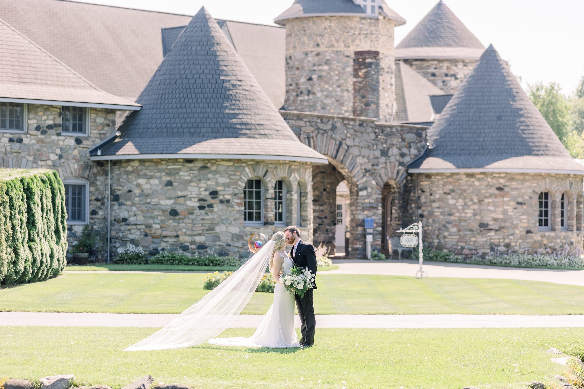 Kiss in front of Castle Farms Wedding Michigan Castle Wedding Charlevoix Wedding