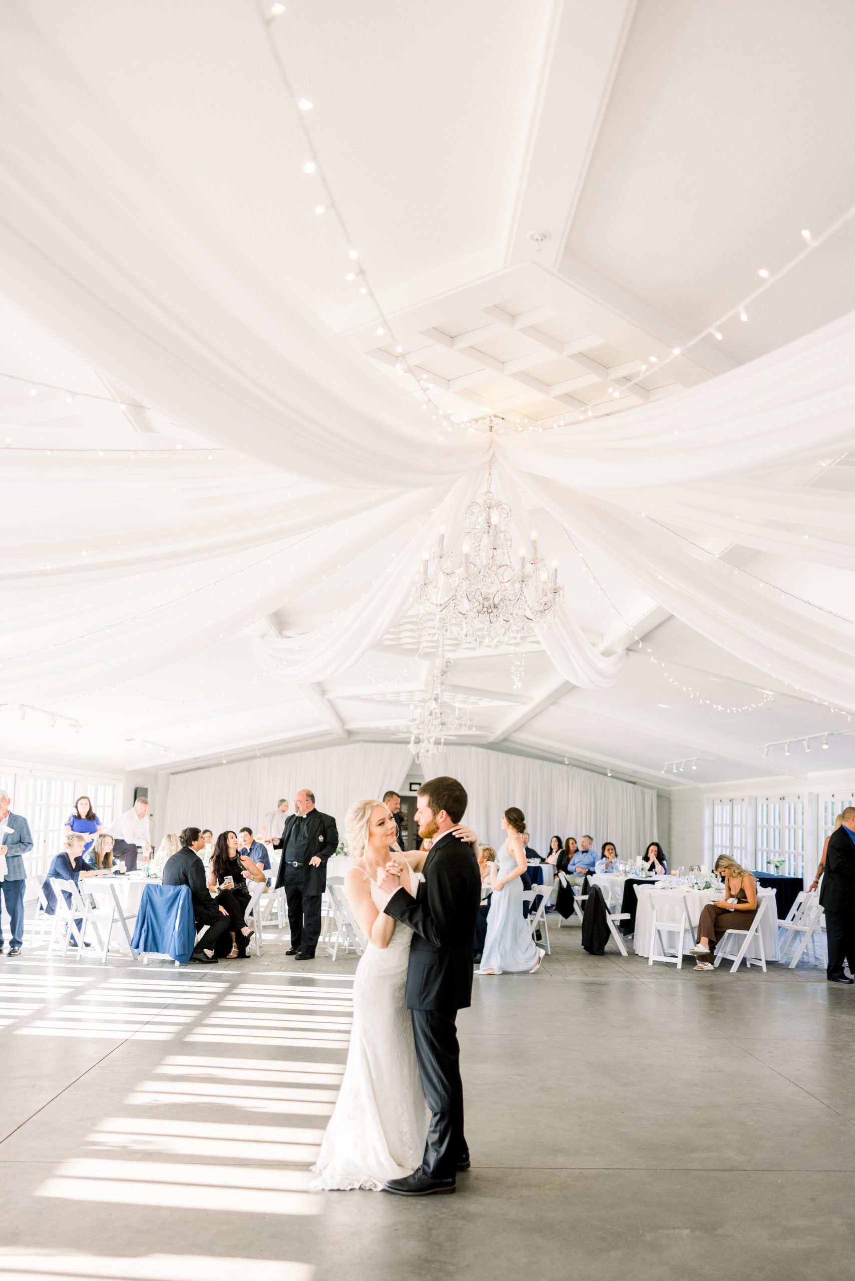 Bride and Groom share first dance in East Garden Room at Castle Farms wedding in Charlevoix, MI