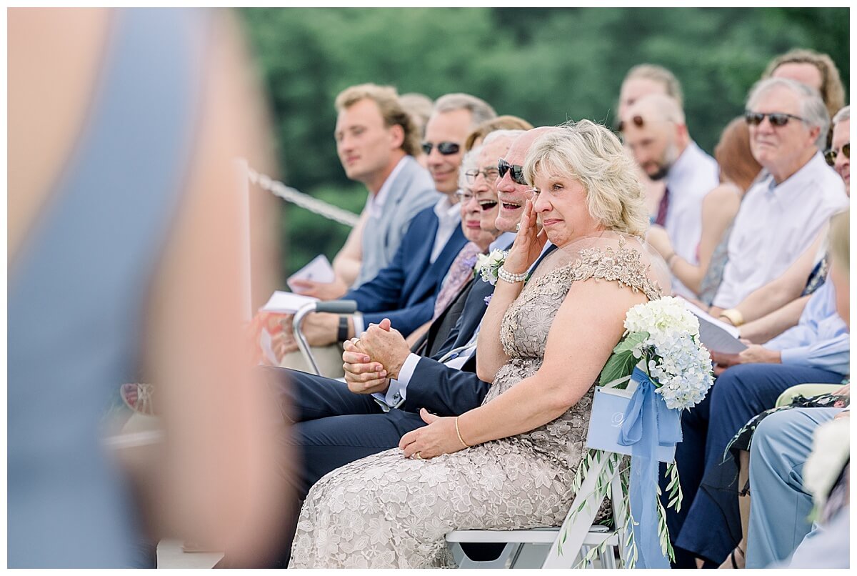 Mother of the Groom cries during emotional Bay View wedding day ceremony.