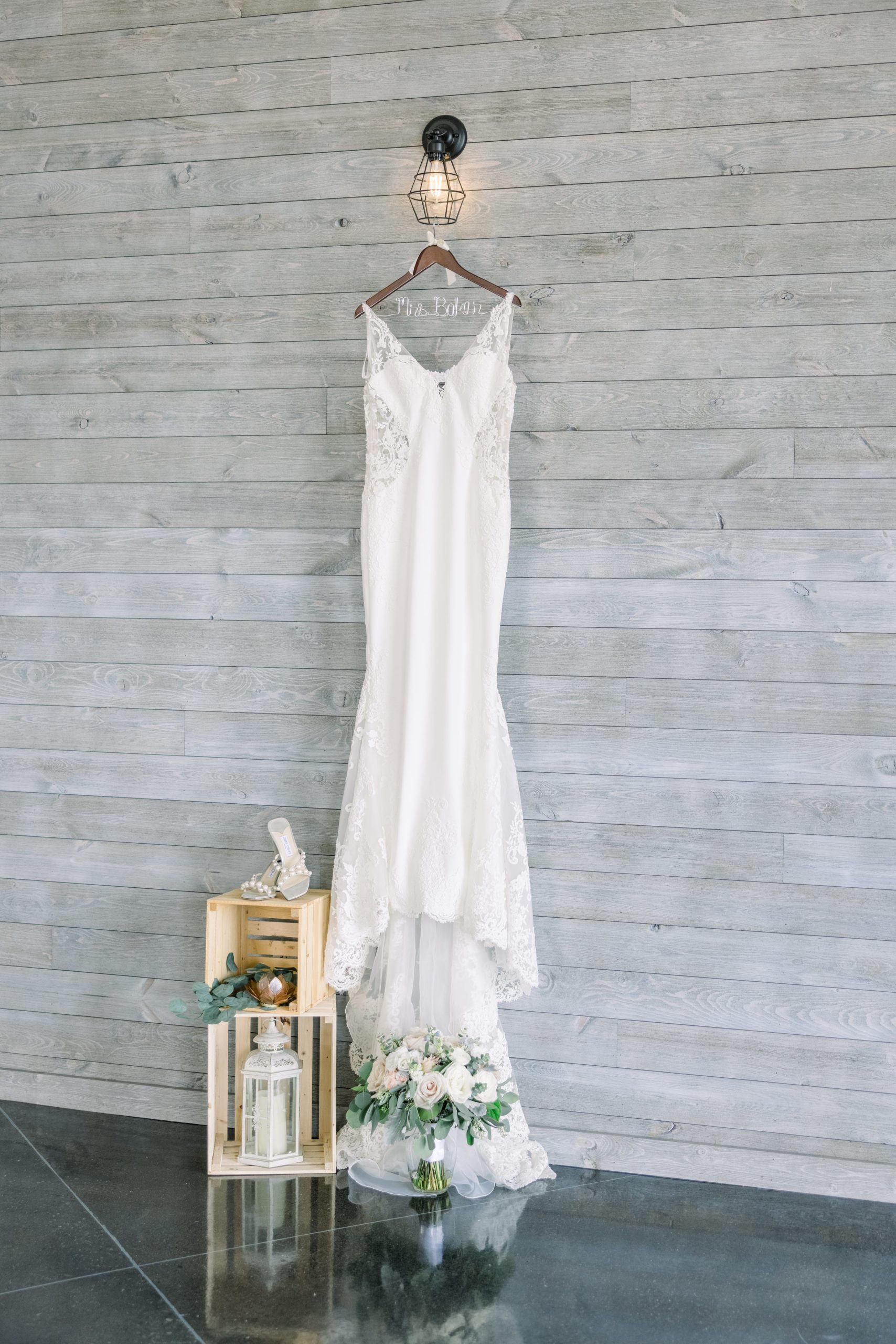 Bride's dress and bouquet for Boathouse on Lake Charlevoix wedding.
