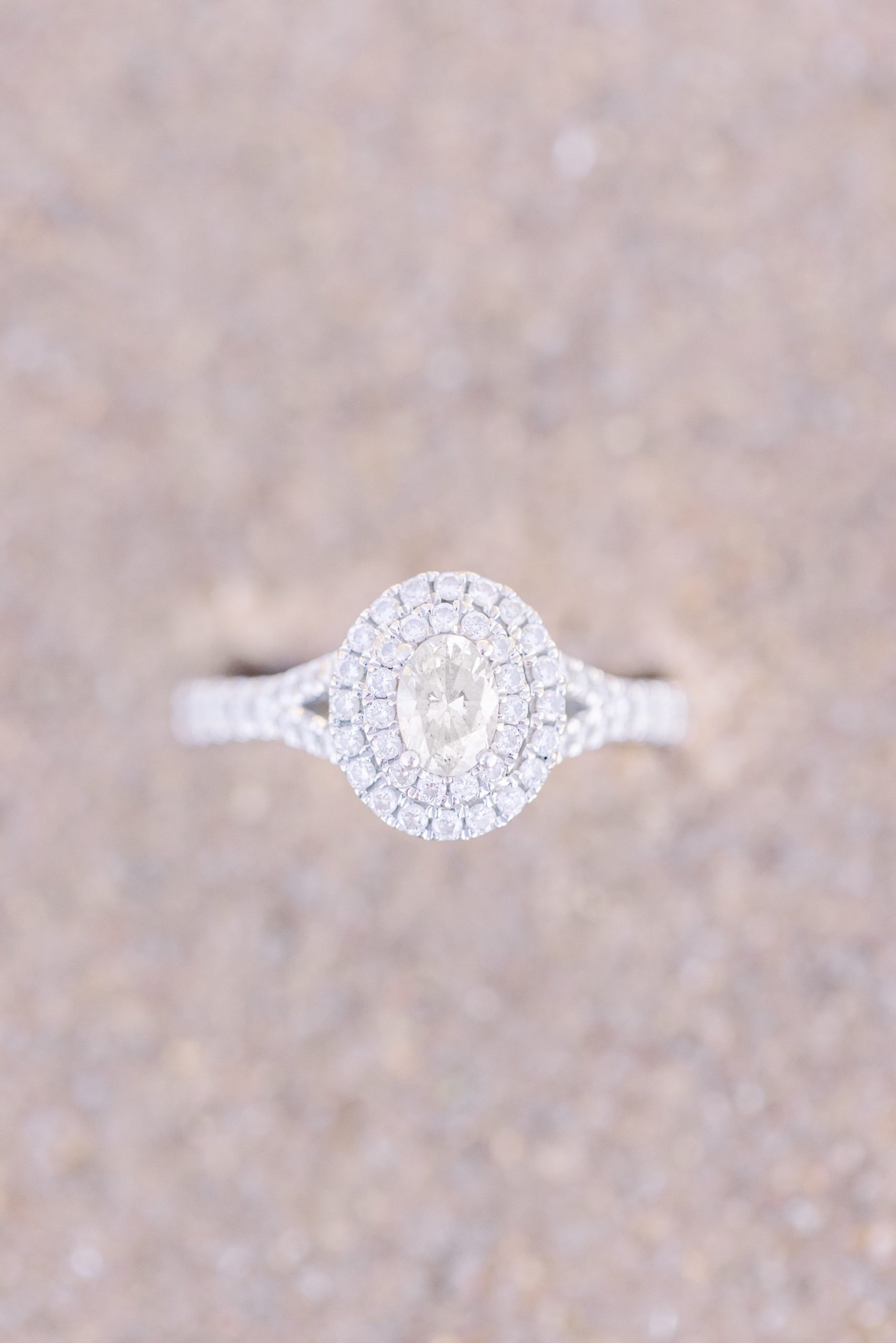 Ring buried in the sand during Harbor Springs Engagement Session.