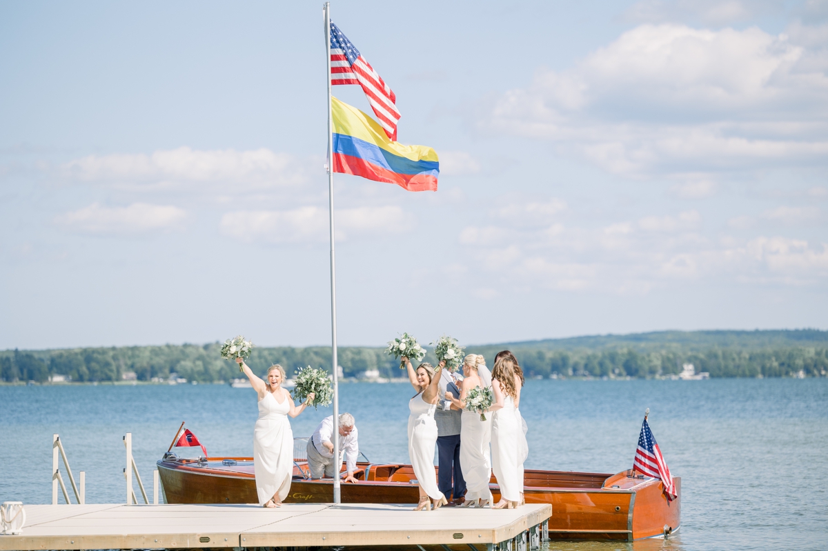 Caitlin and her bridesmaids arriving to her wedding ceremony by boat.
