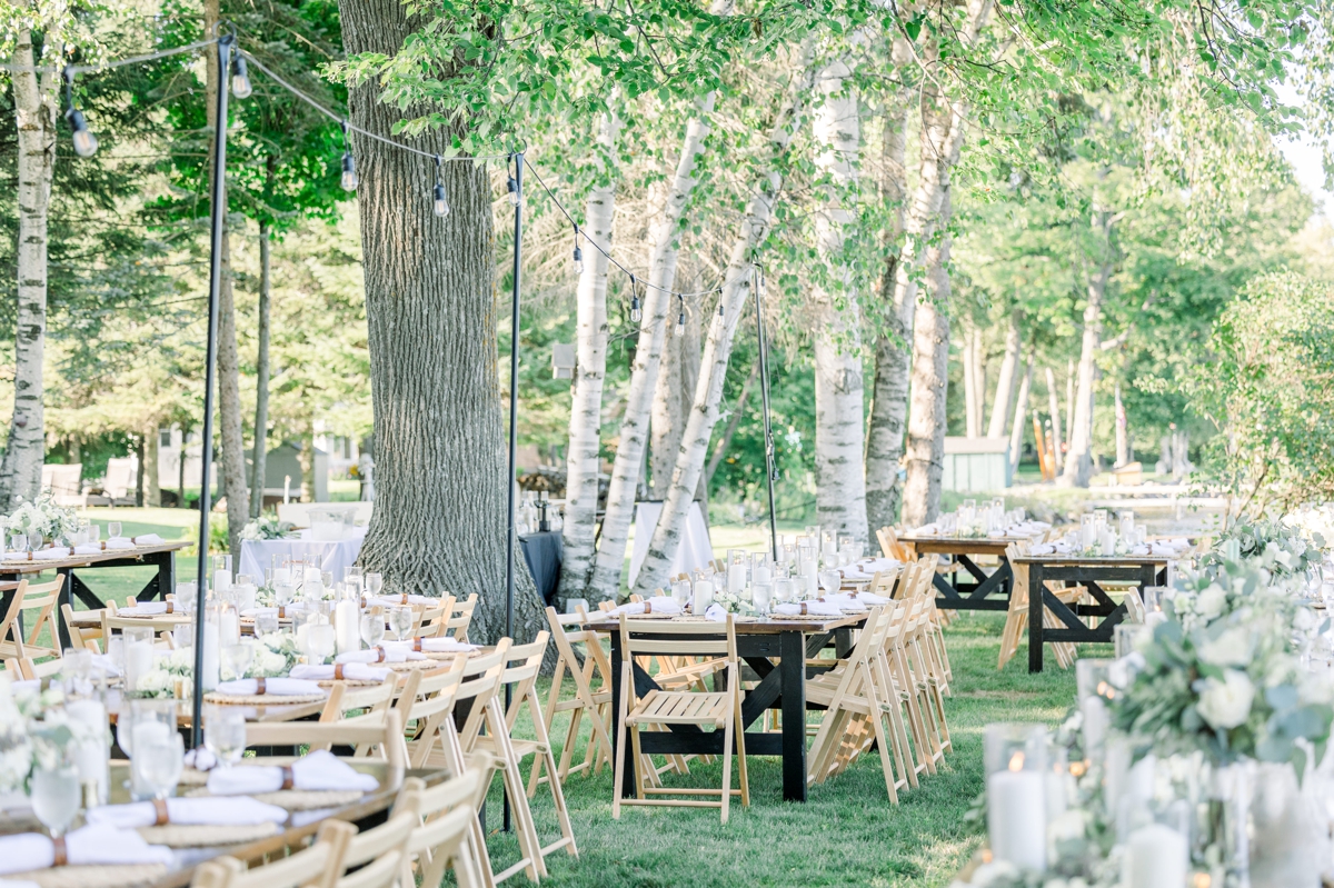 An overview of the enchanted reception set up for Caitlin and Andre's Northern Michigan lake house wedding reception.